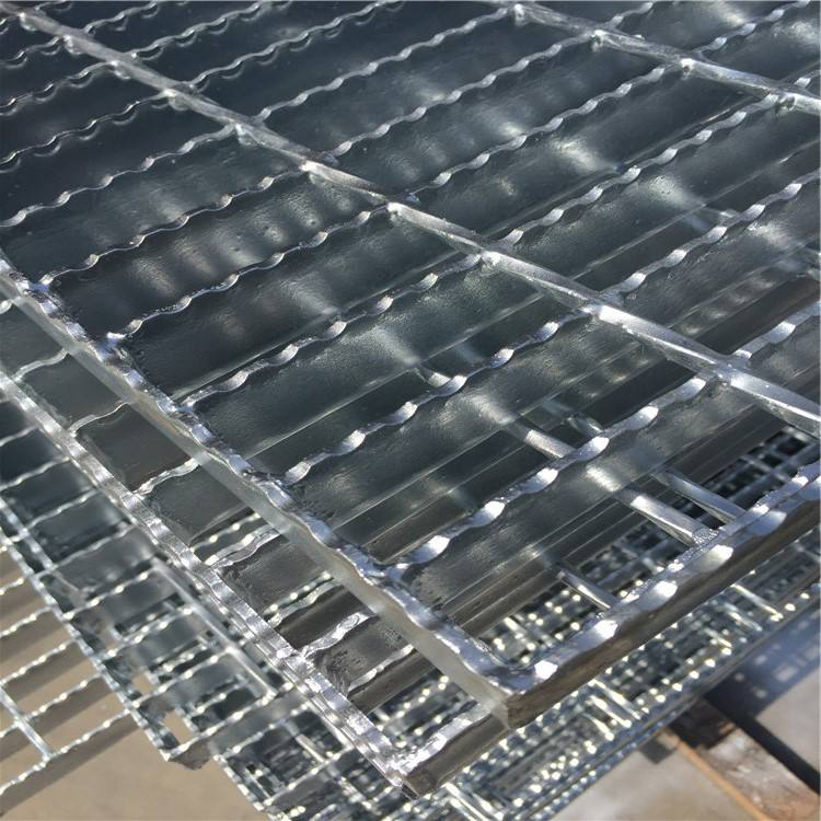 Large welded steel grating panels stacked in factory warehouse ready for shipment