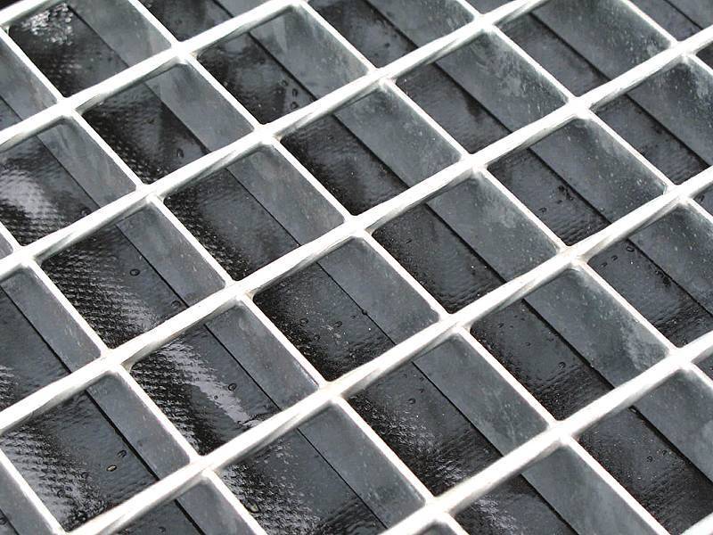 Close-up of galvanized steel grating bearing bar spacing detail