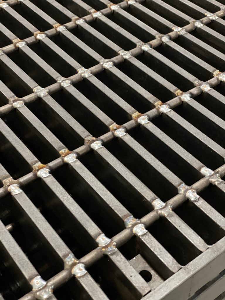 Galvanized steel grating panels for industrial walkways